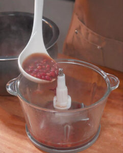 Scoop out half of the cooked red bean soup and transfer it to a blender