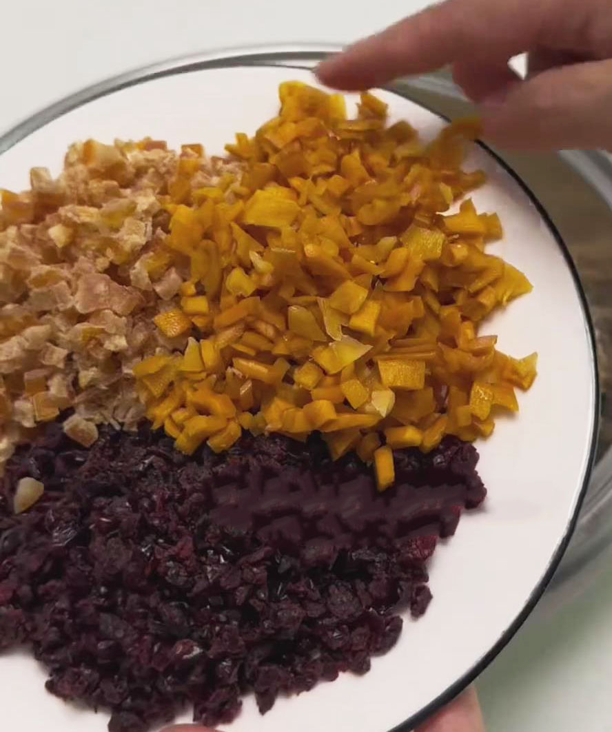 Add dried cranberries, diced tangerines, and dried mango