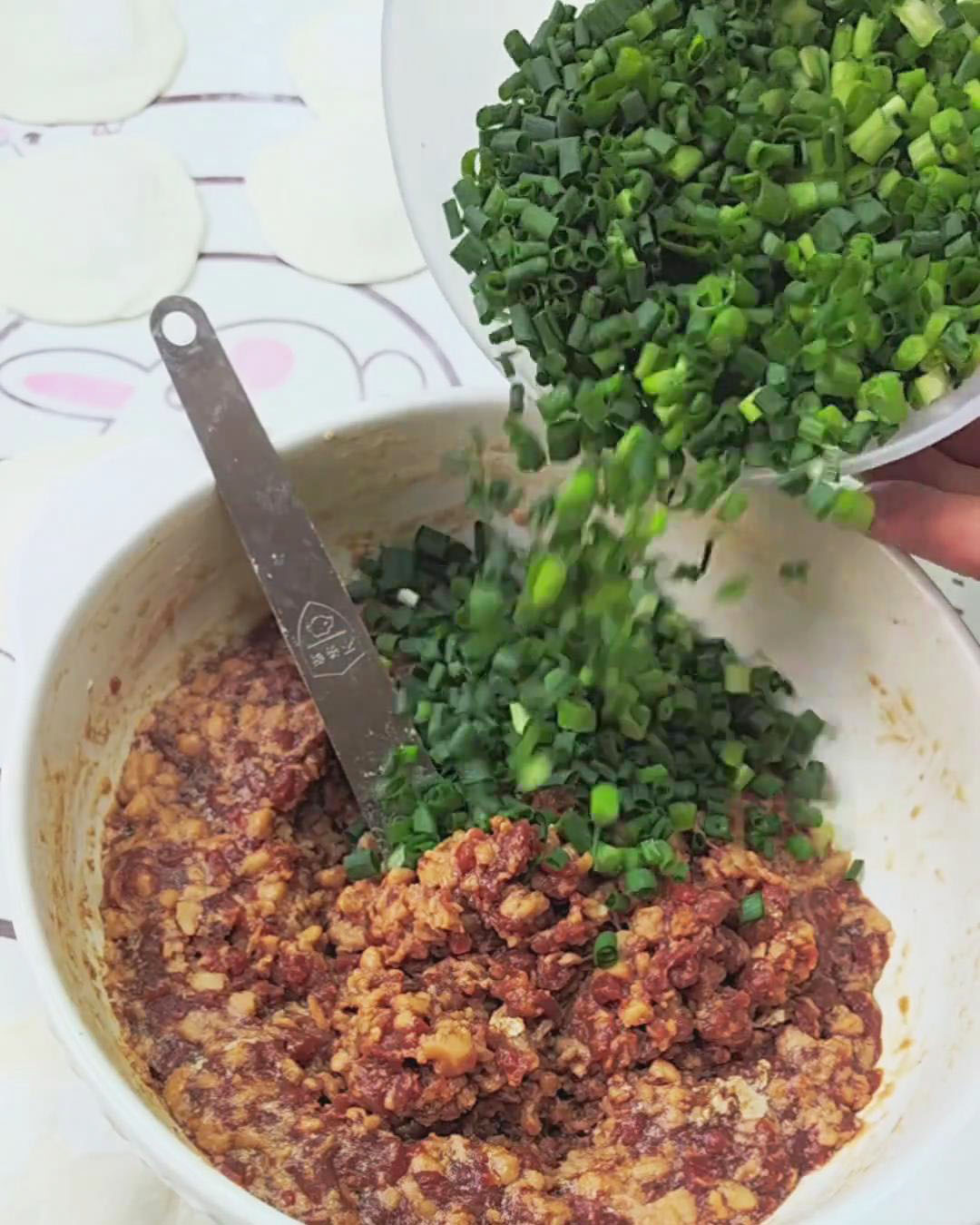 Add some chopped green onions to the filling