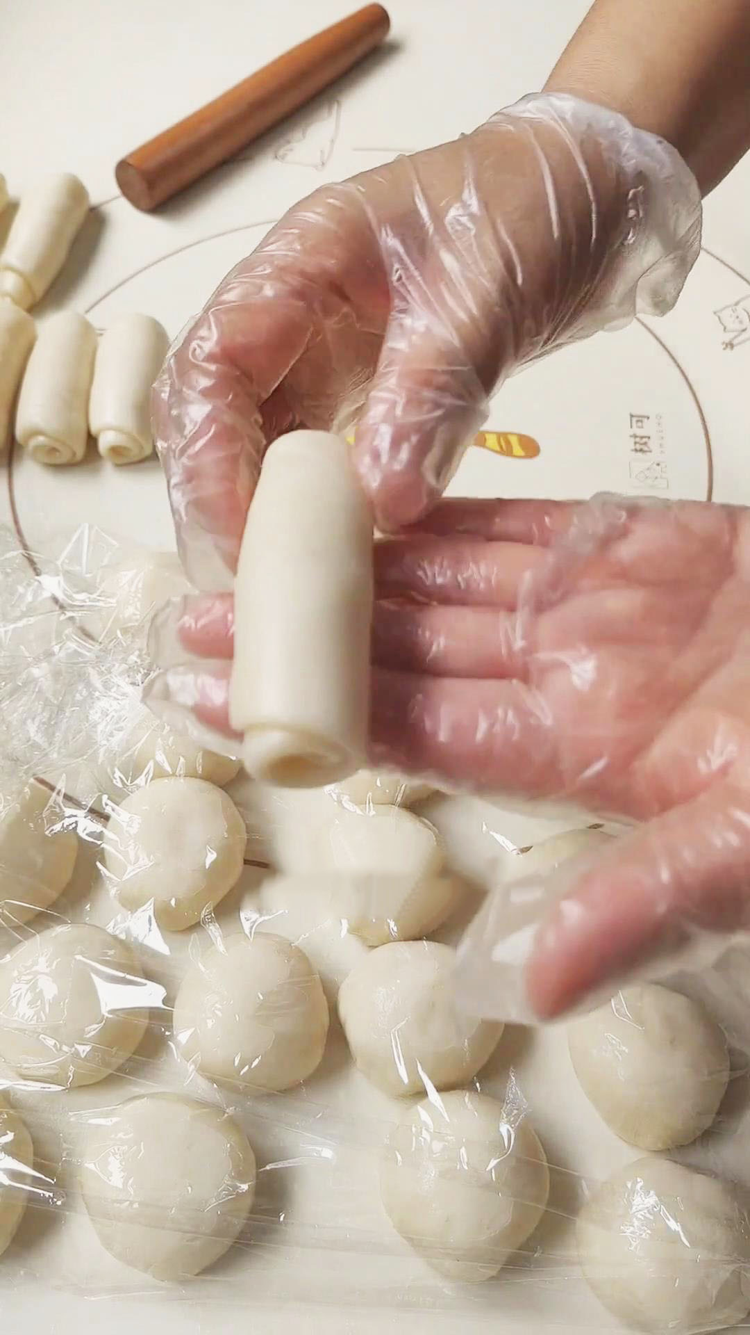 Roll each portion into a long oval shape and then roll it up