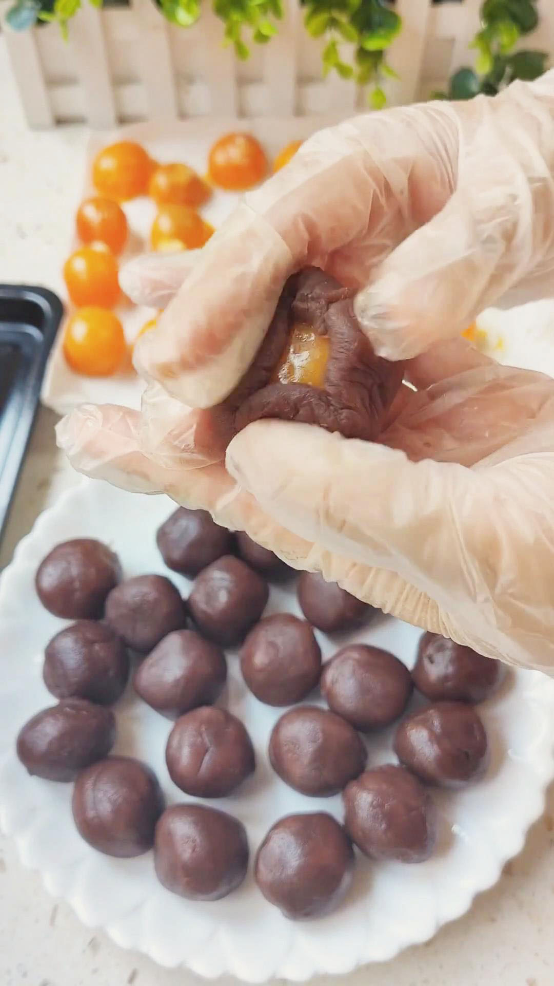 Wrap the salted egg yolks with the red bean paste