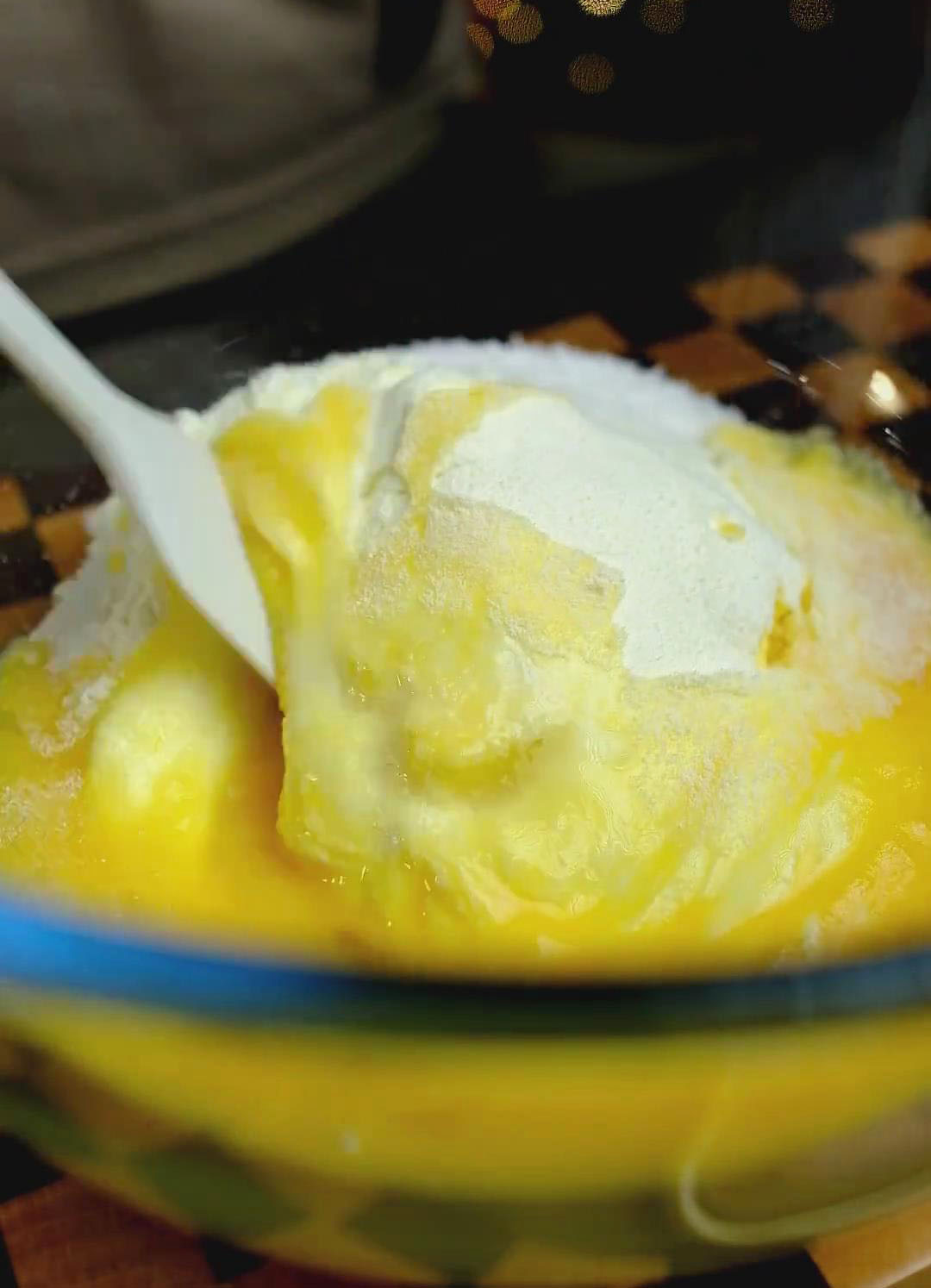 In another bowl, mix 50g softened butter with 100g desiccated coconut, 40g milk powder, and 30g sugar until well combined.