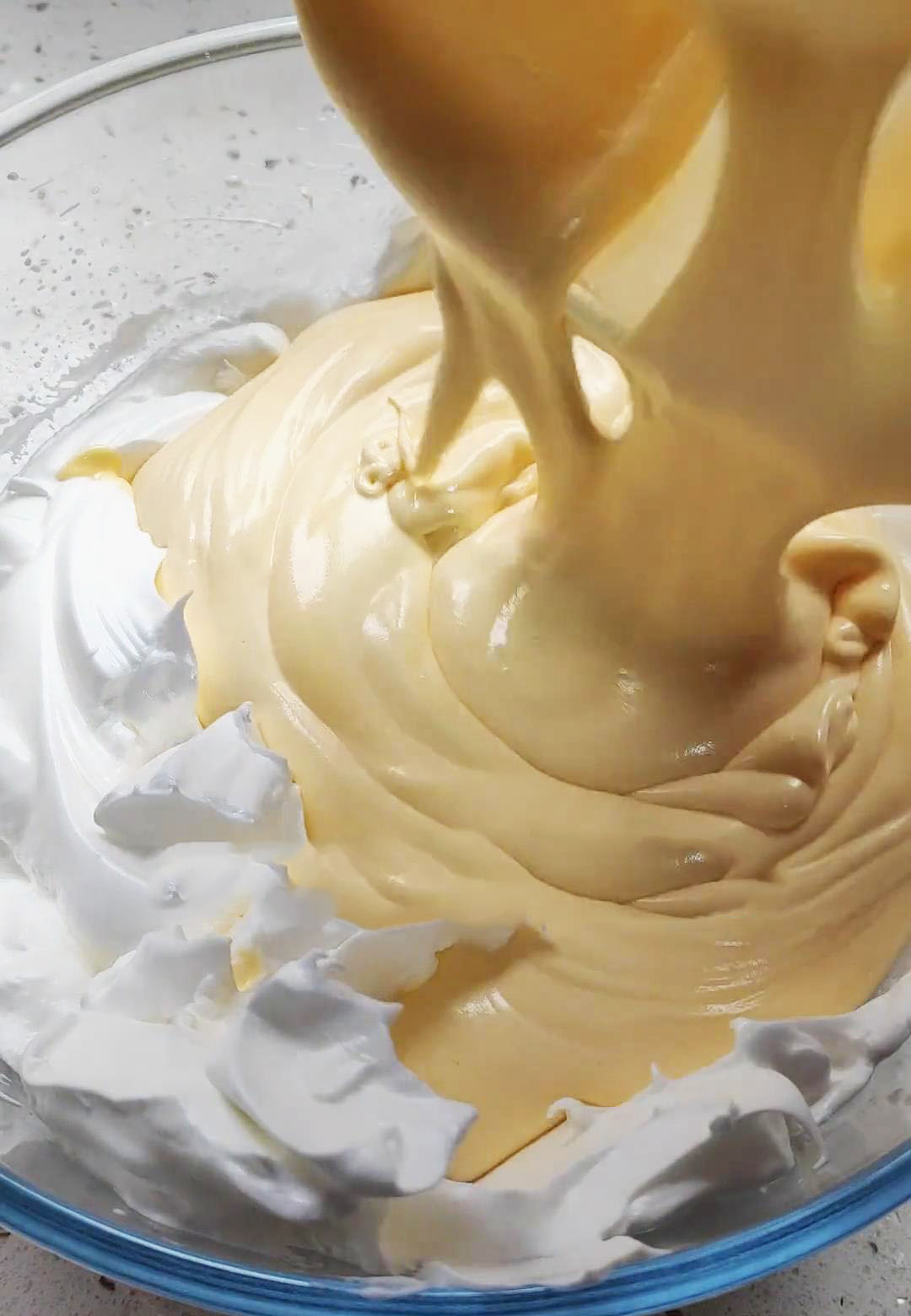 Pour the combined mixture into the remaining egg whites