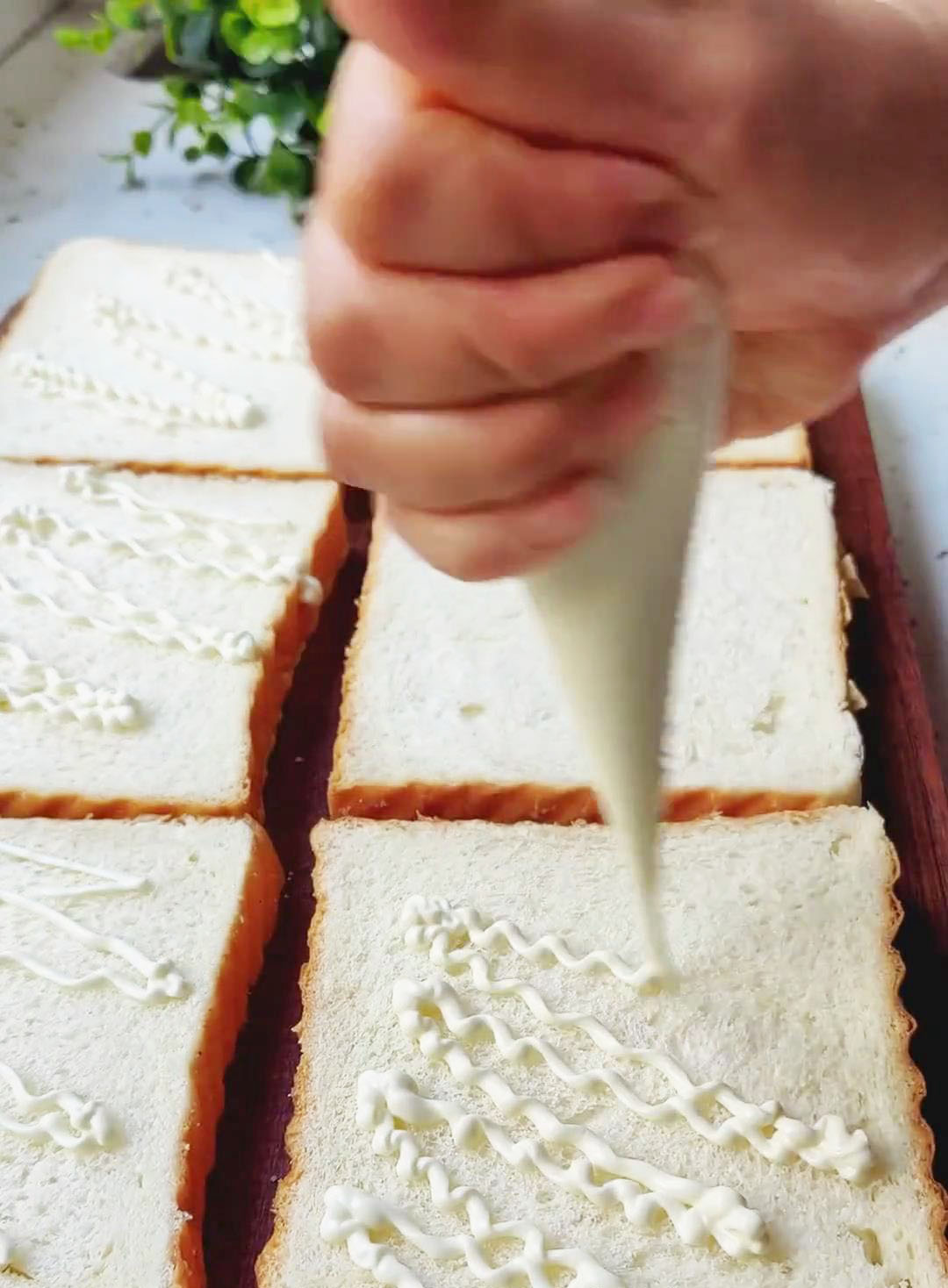 Spread a thin layer of mayonnaise on each slice