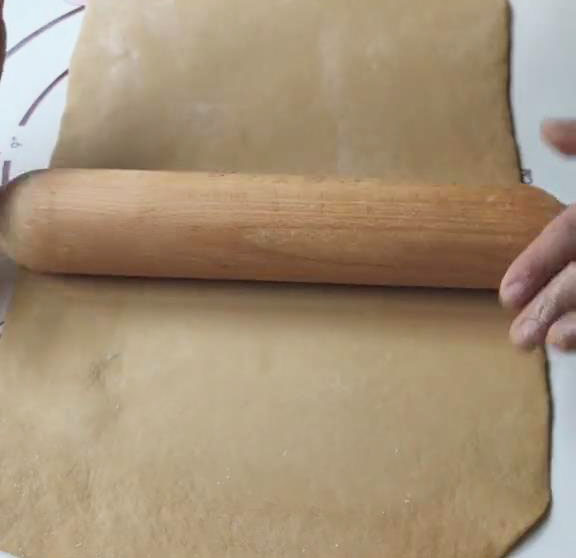 roll the dough into a large rectangular sheet