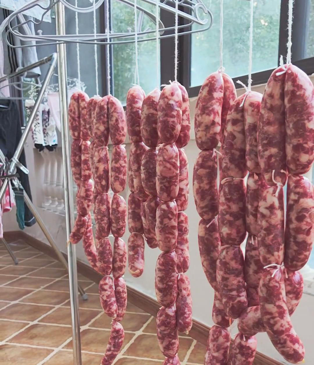 Hang the sausages in a well ventilated, sunny spot