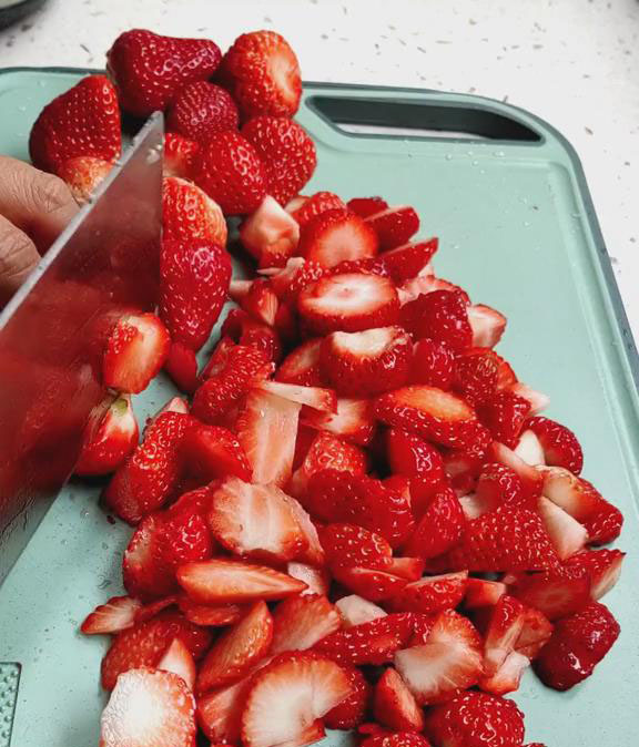 Cut strawberries into small pieces