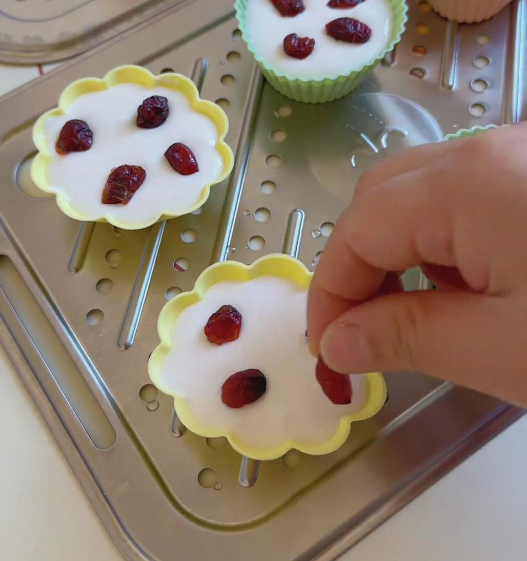 Add dried cranberries on top