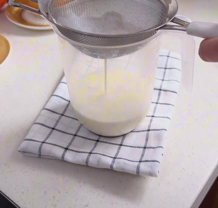 Place a fine mesh strainer over a clean bowl and pour the mixture through Place a fine mesh strainer over a clean bowl and pour the mixture through
