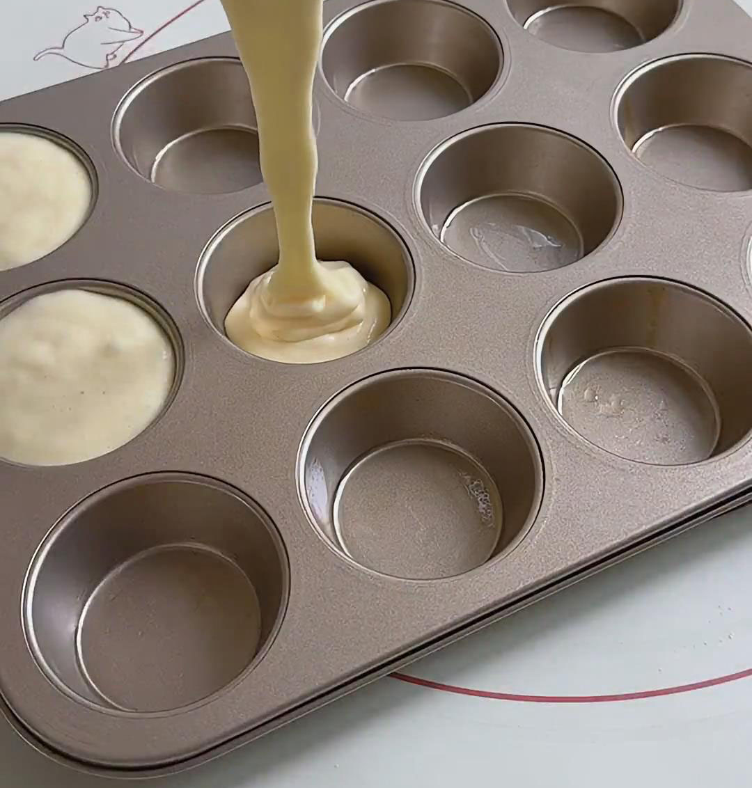 Pour the batter into the greased molds