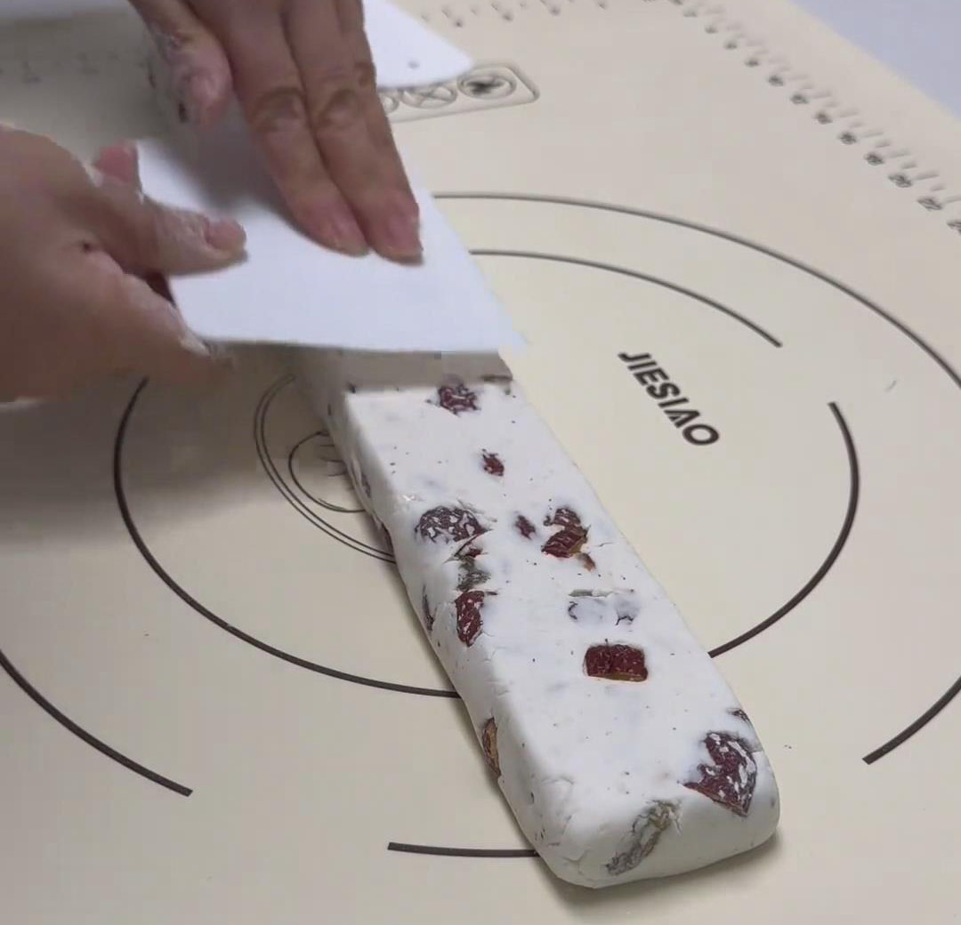 flattening it with a scraper flattening it with a scraper