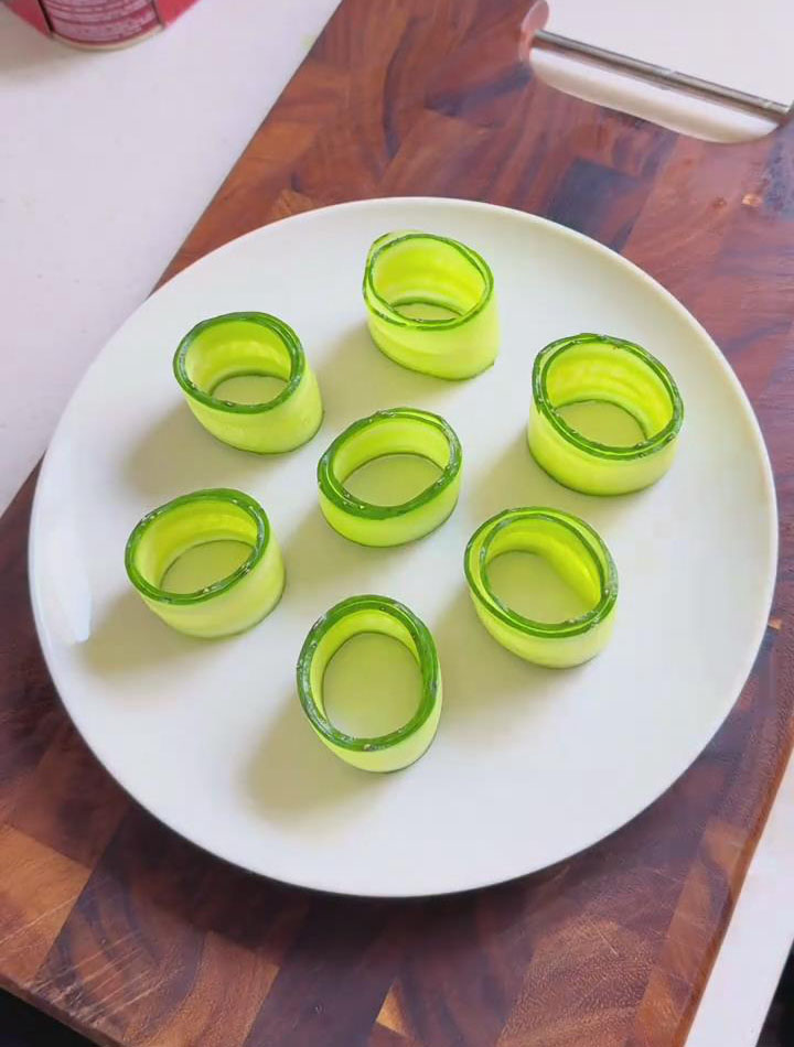 roll up each cucumber strip and set them aside