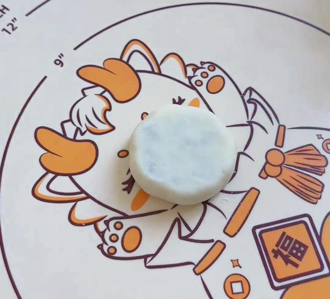 gently press the dough into a flat, round shape