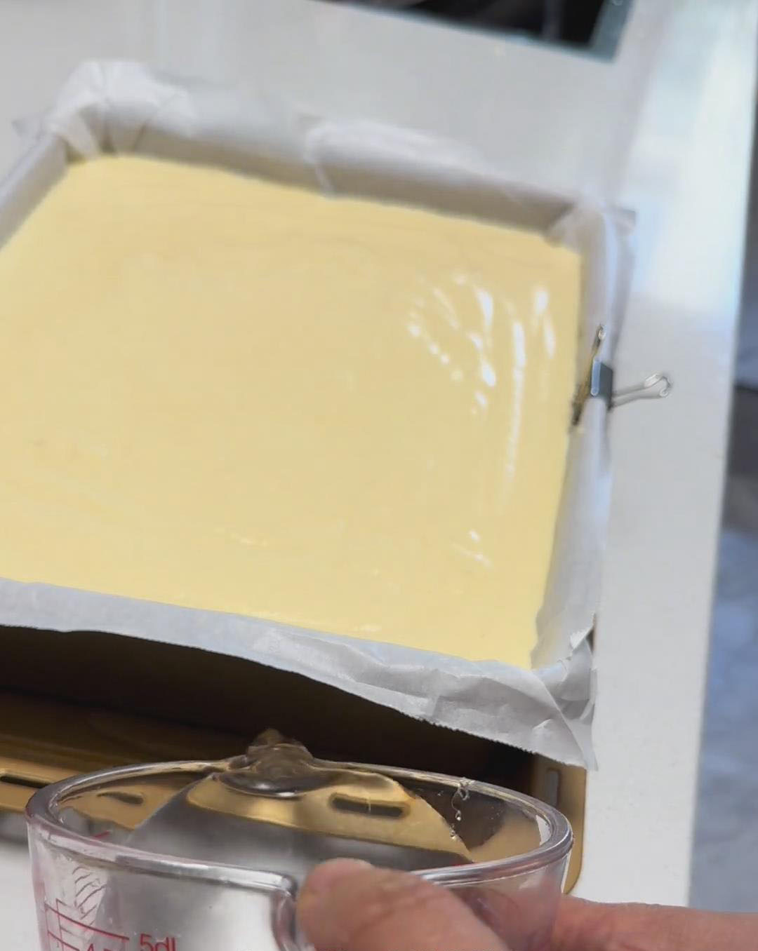 pour hot water into the tray