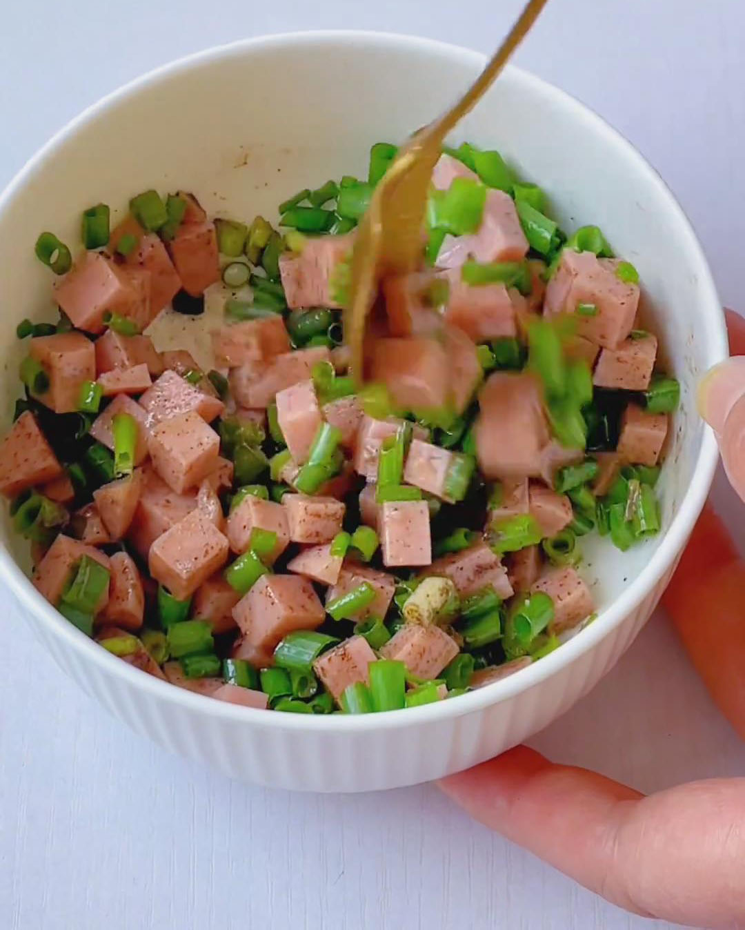 Add cooking oil and mix well using chopsticks, making sure all ingredients are evenly coated