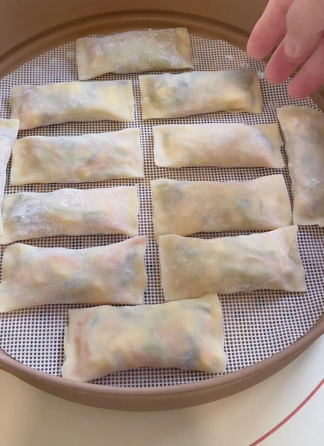 Arrange the wrapped wontons in the steamer Arrange the wrapped wontons in the steamer