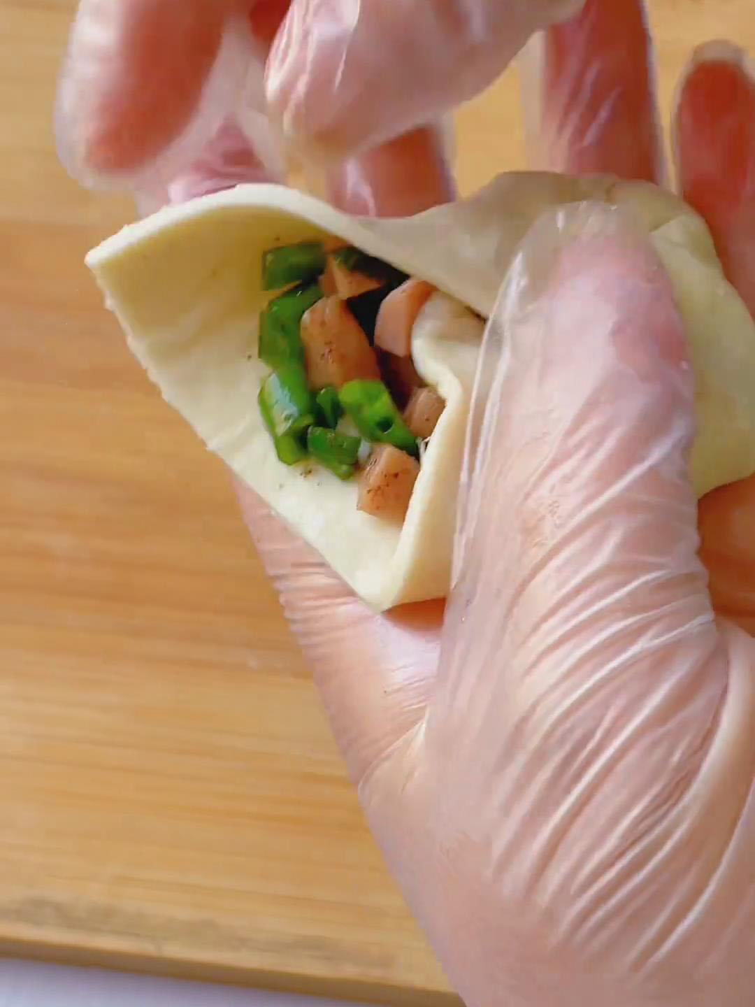 Bring all edges together like wrapping a bun