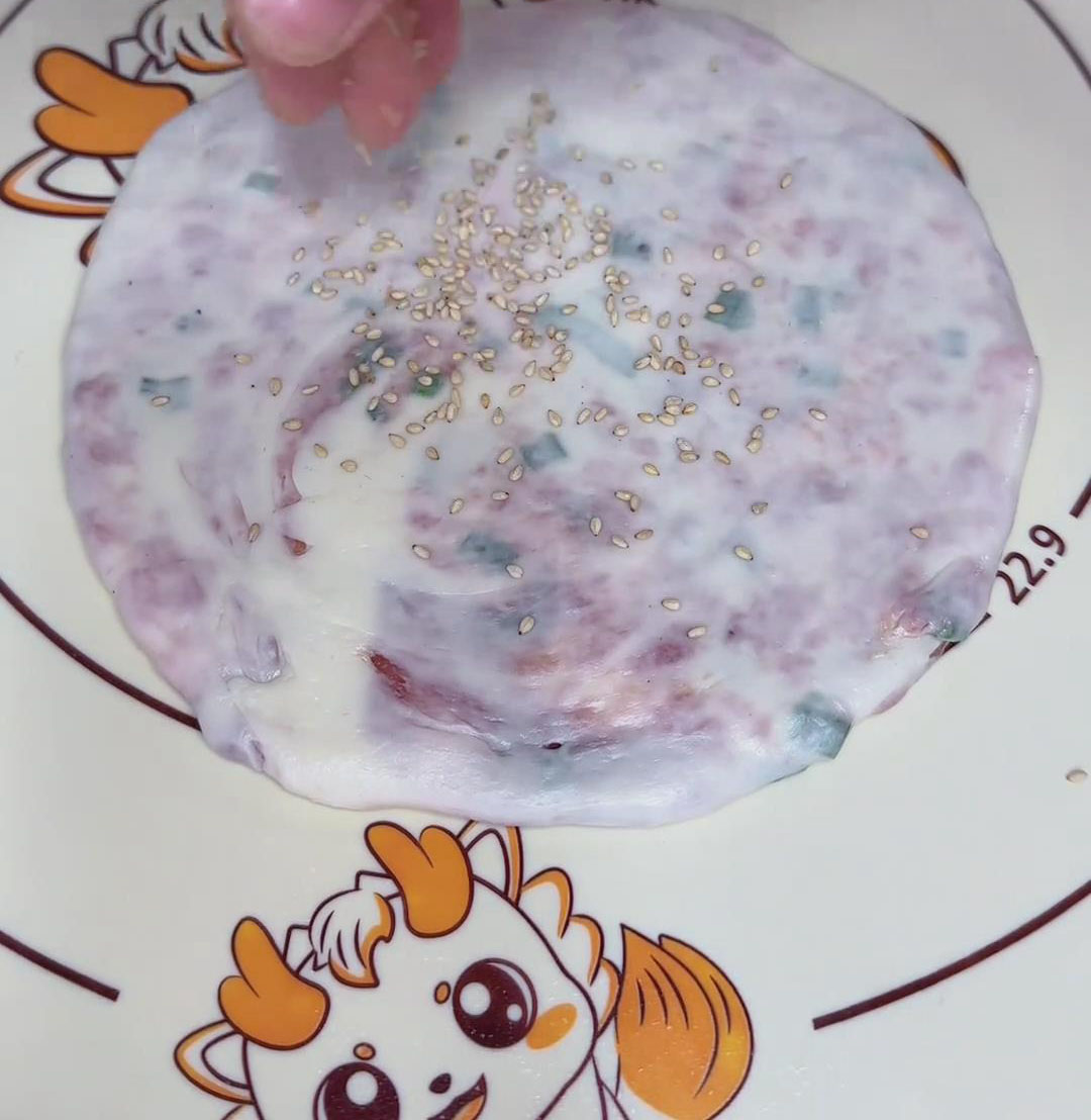 Brush with water and sprinkle with sesame seeds