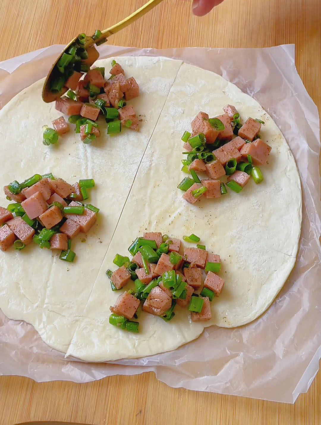 Place about 2 spoonfuls of filling in the center of each square