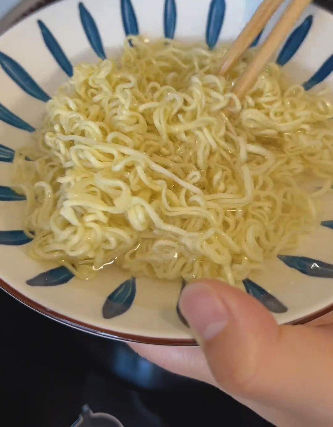 Remove the noodles, fluff with chopsticks to separate, and rinse under cold water
