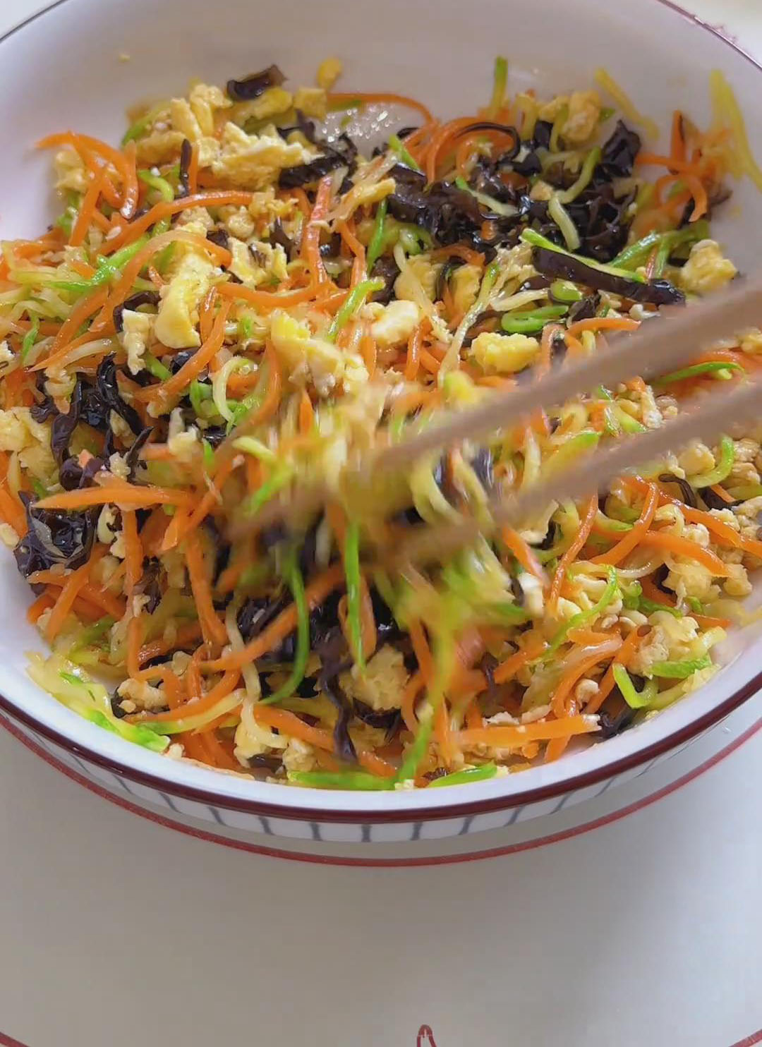 Stir with chopsticks until everything is evenly mixed Stir with chopsticks until everything is evenly mixed