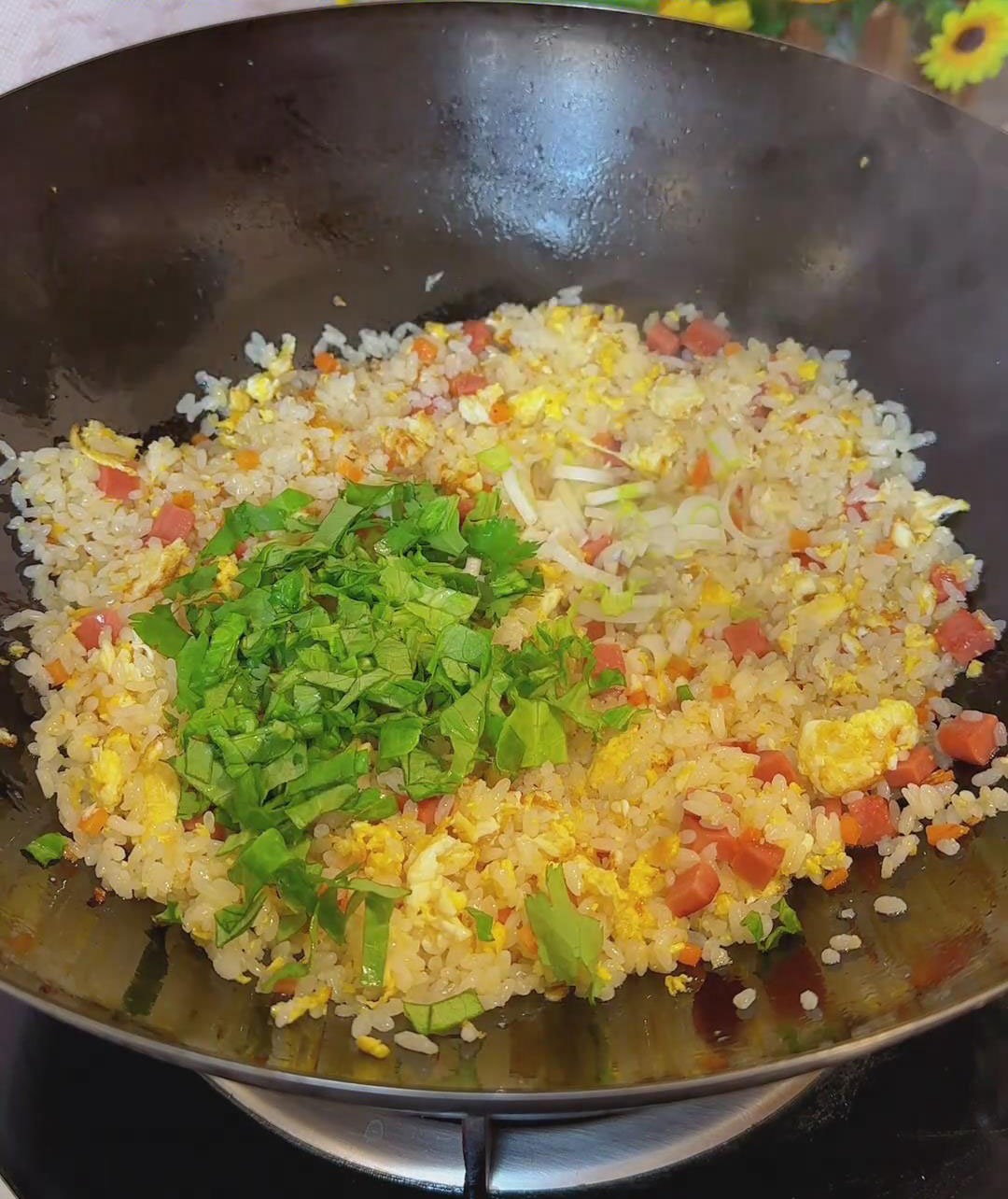 Toss in the leafy greens and chopped scallions