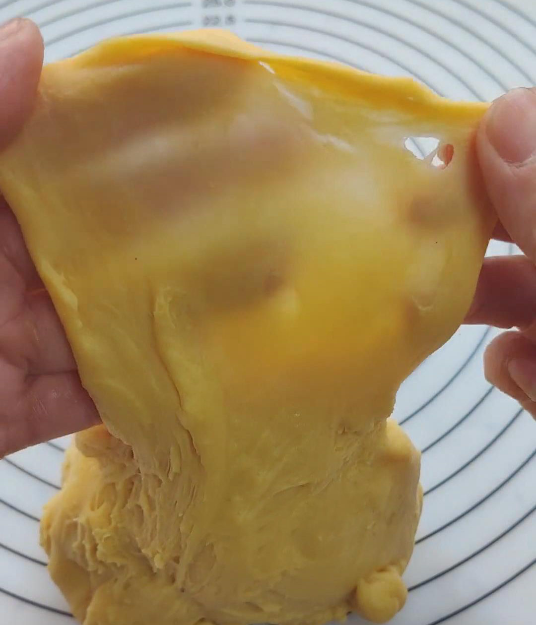 Knead until you can pull a “glove film”