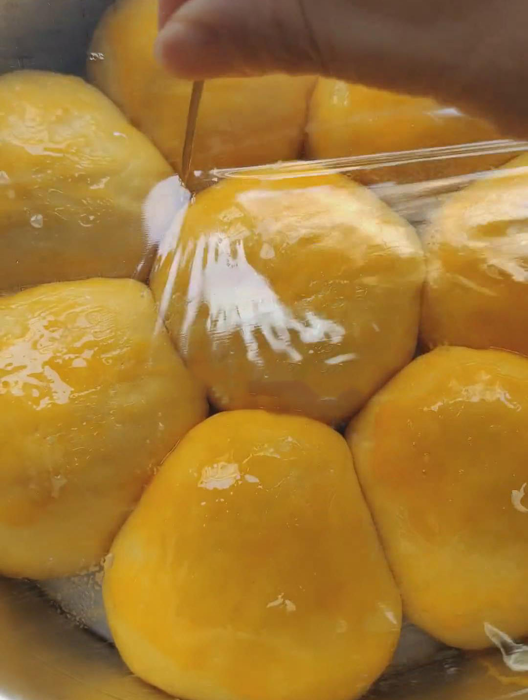 Use a toothpick to poke a few holes in the plastic wrap