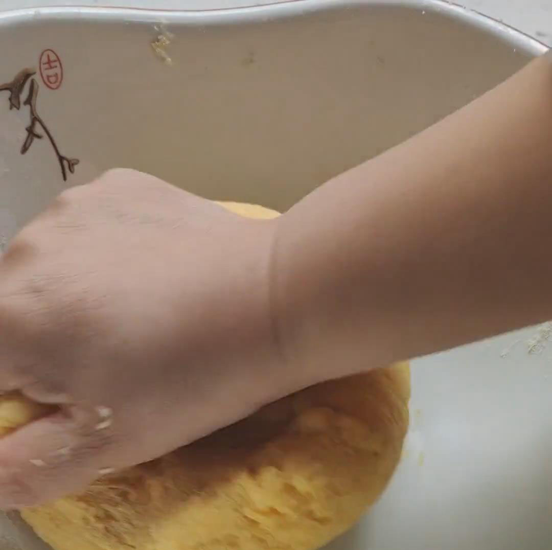 begin kneading the dough by hand