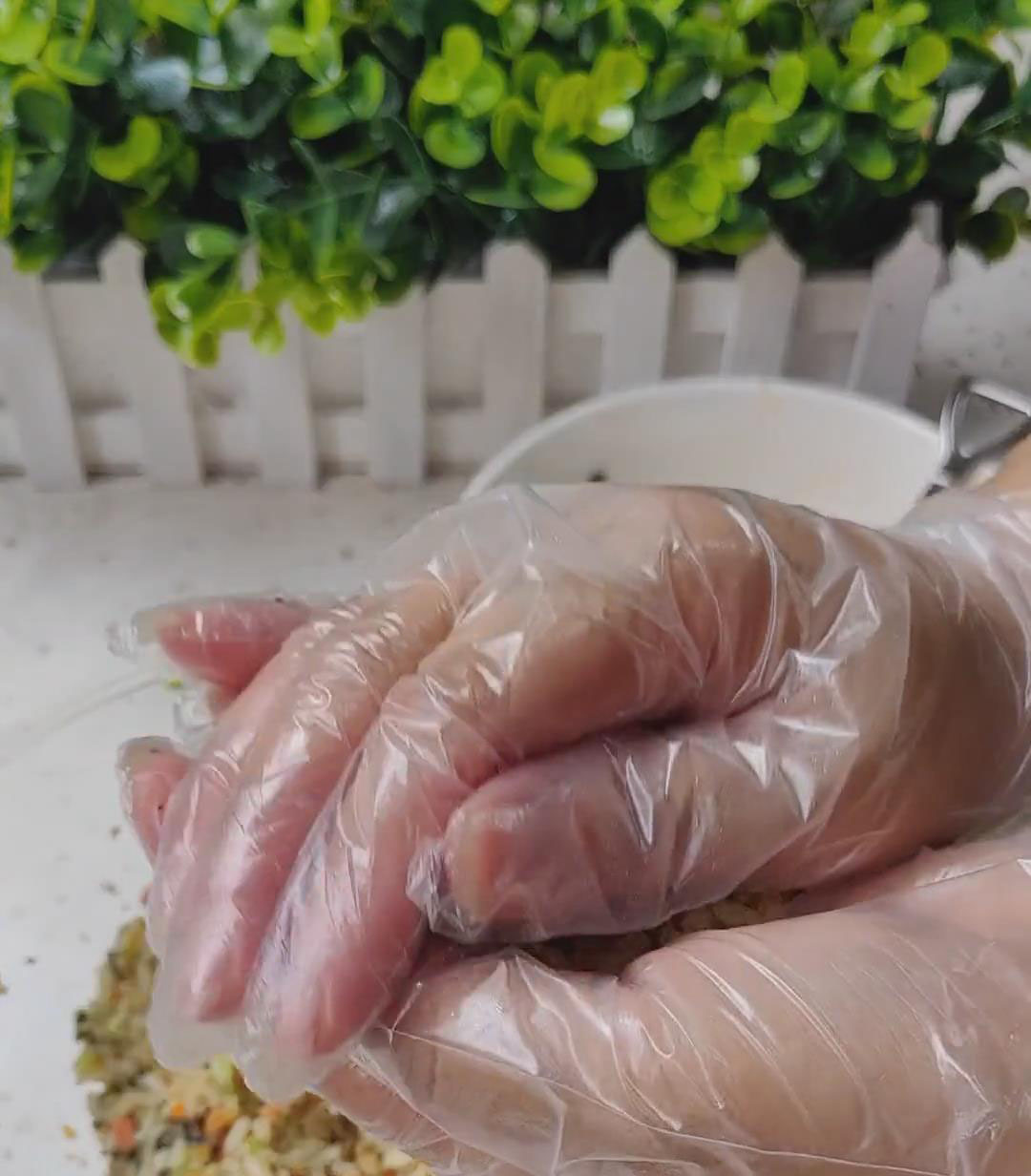 Carefully wrap the rice around the filling