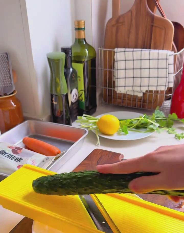Grate cucumber into shreds Grate cucumber into shreds