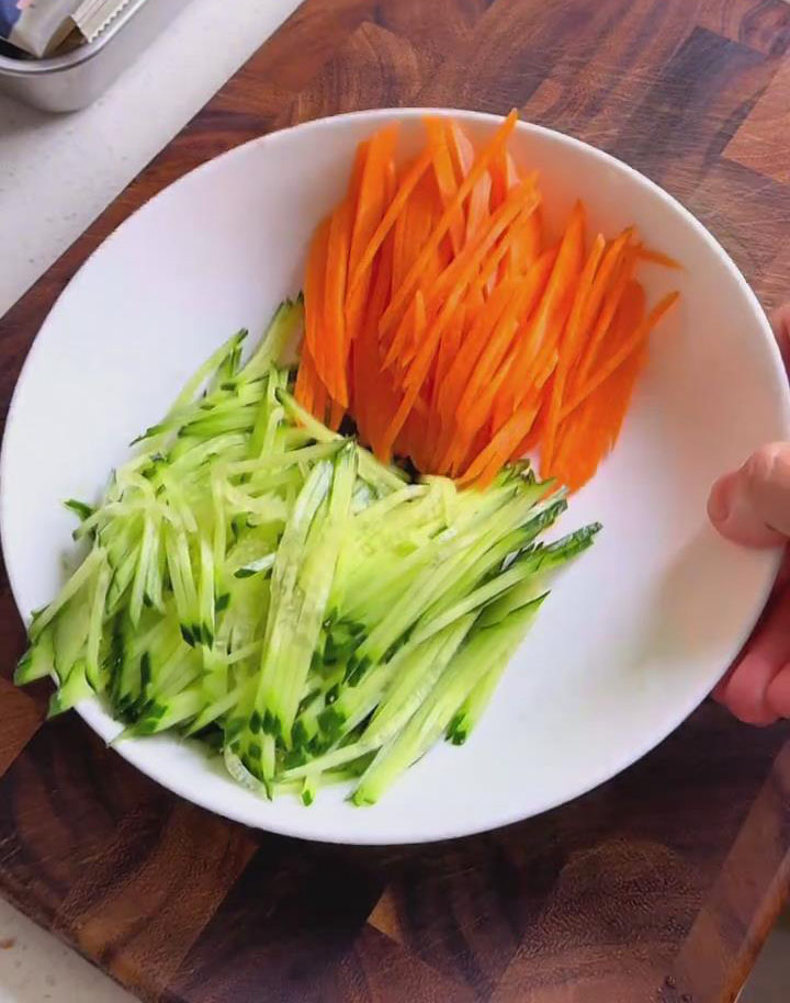 shredded cucumber and carrots shredded cucumber and carrots