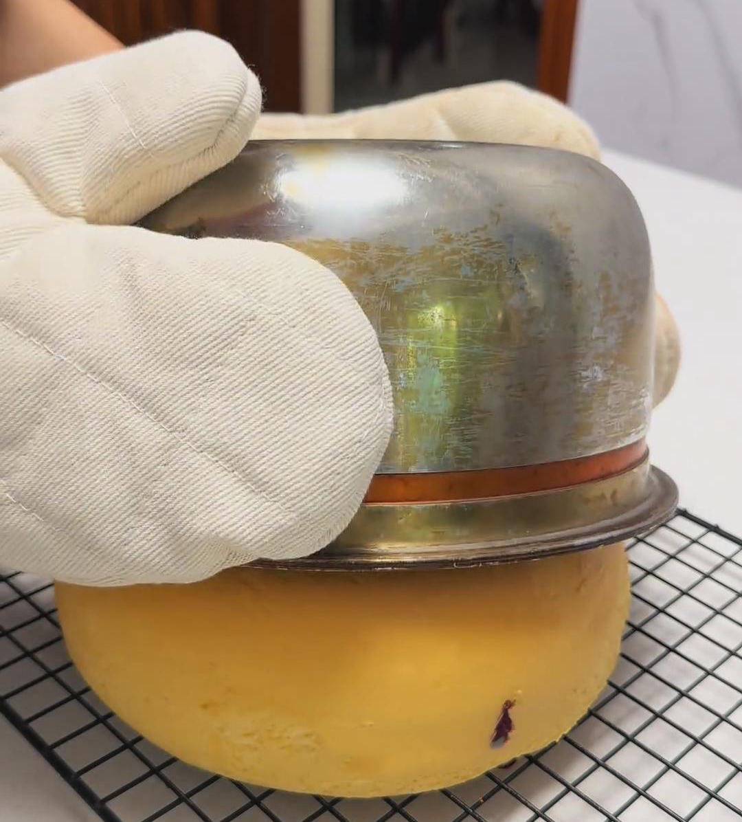 Gently lift off the inner pot Gently lift off the inner pot