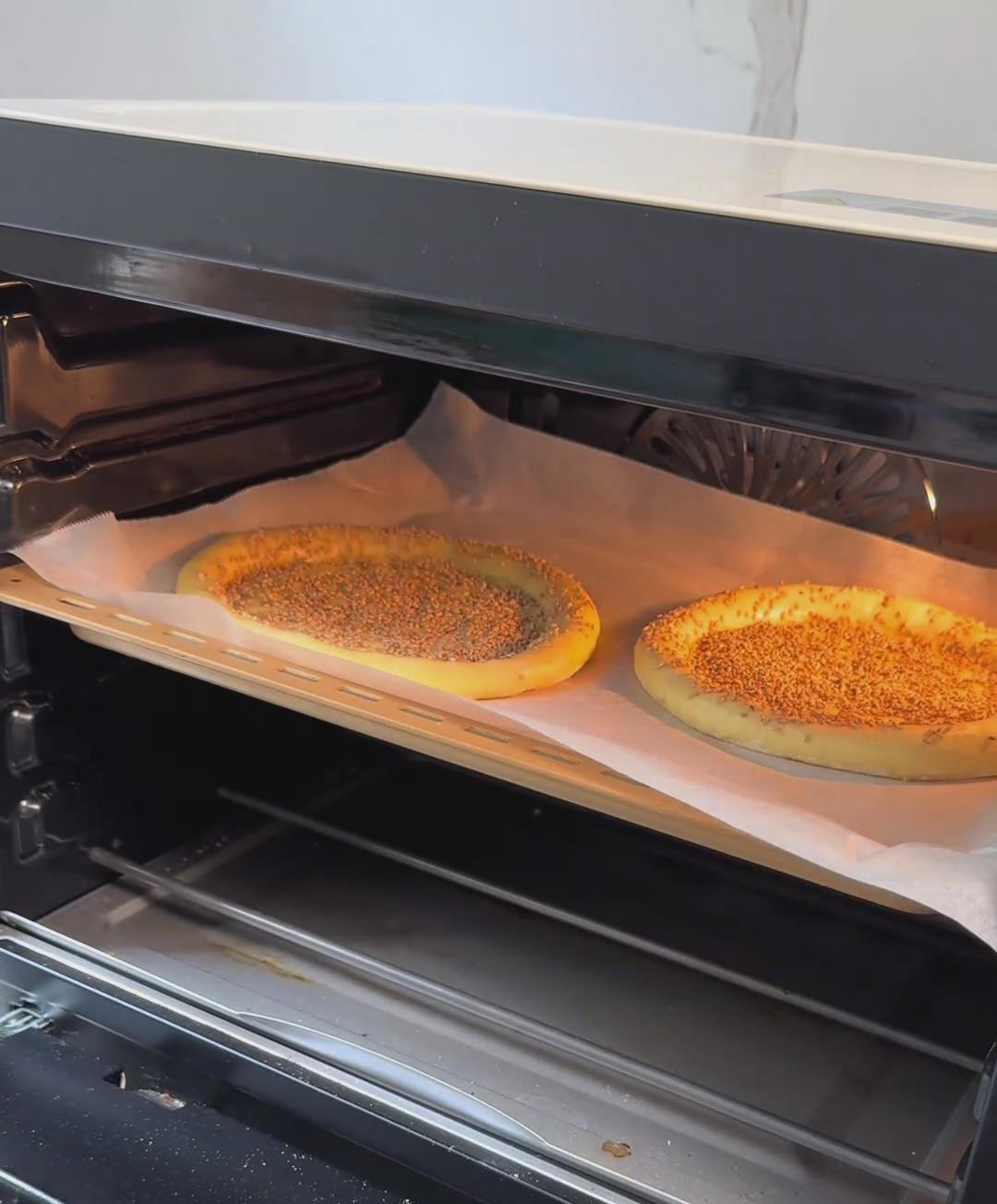 Place the naan on the middle rack and bake Place the naan on the middle rack and bake