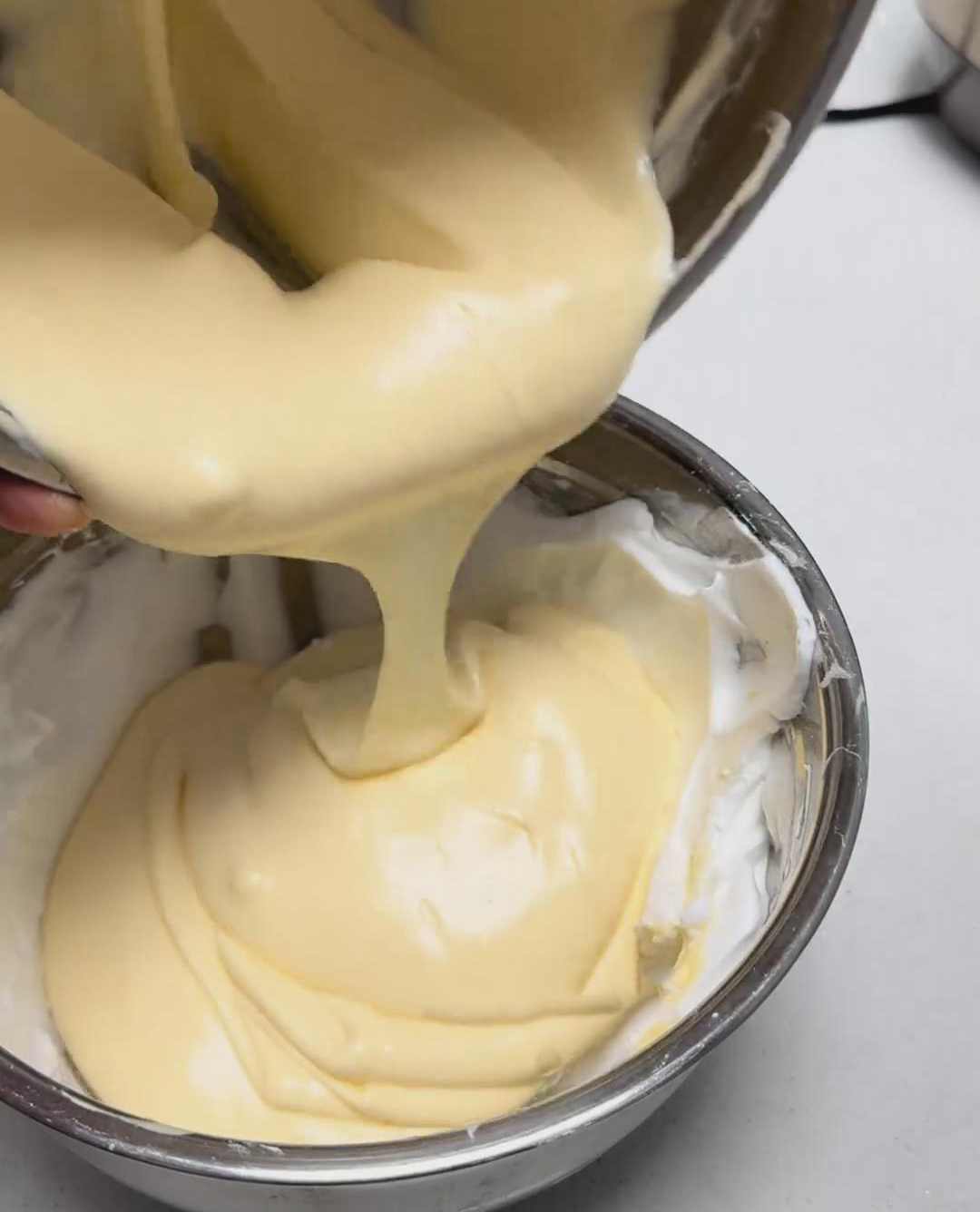 Pour this mixture back into the remaining meringue Pour this mixture back into the remaining meringue