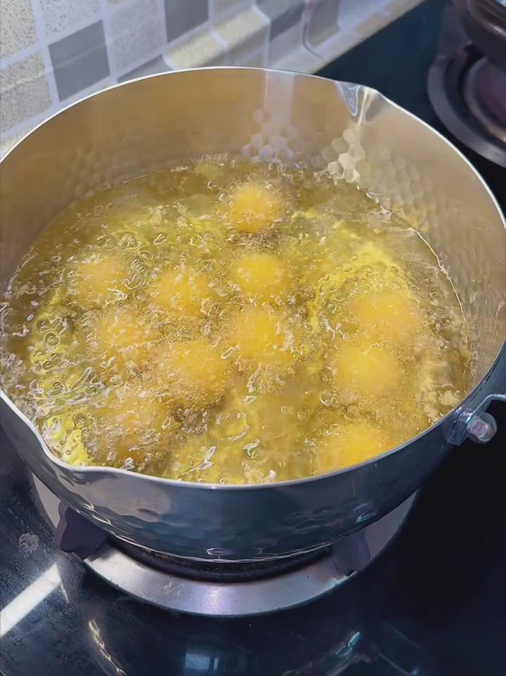 Add the breadcrumb coated sweet potato balls
