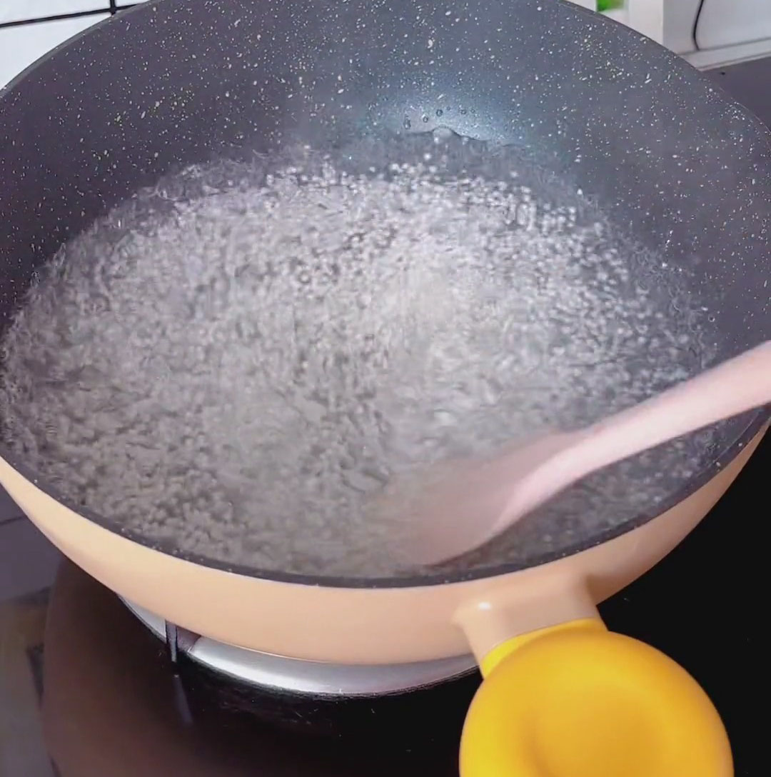 Add the sago pearls and stir immediately to prevent sticking