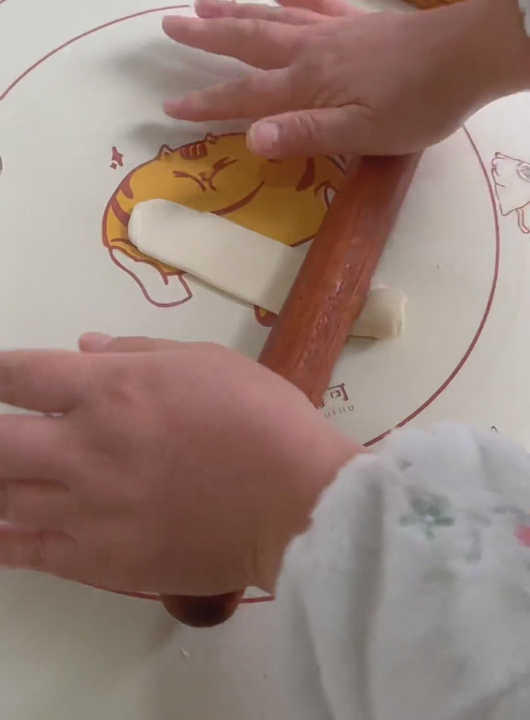 After resting, take one cylinder and roll it out again into a tongue shape