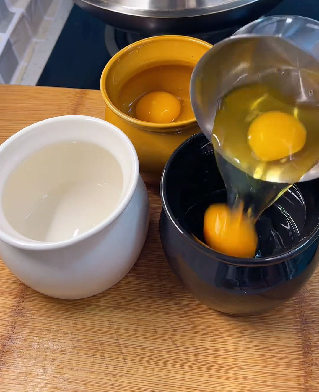 Crack 2 eggs into each pot (3 pots total) Crack 2 eggs into each pot (3 pots total)