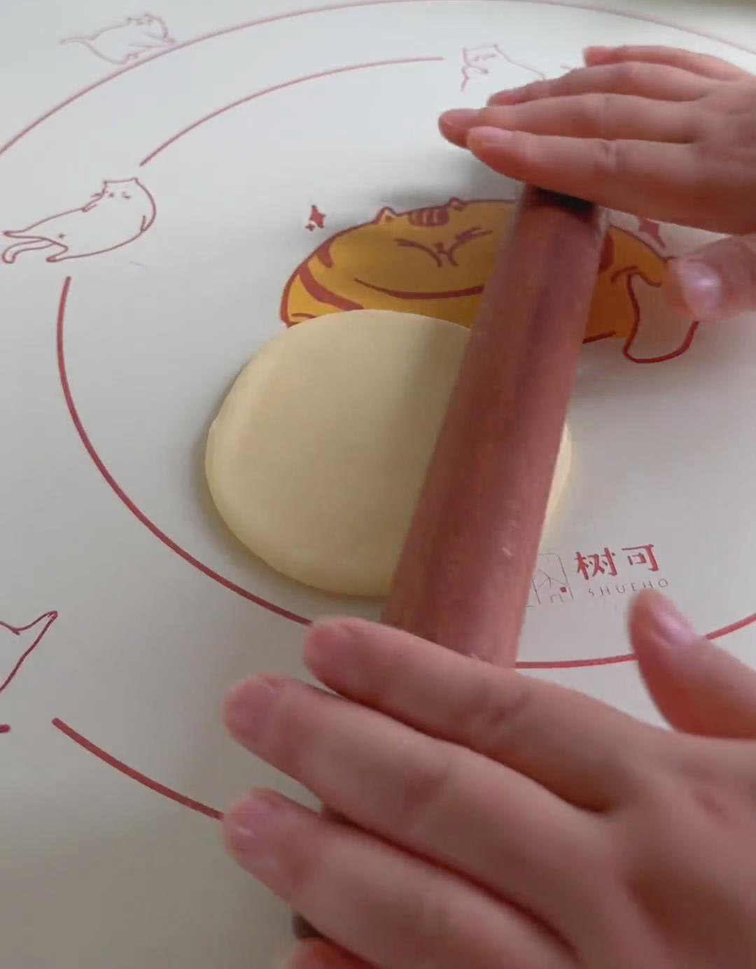 Flatten each ball with a rolling pin Flatten each ball with a rolling pin