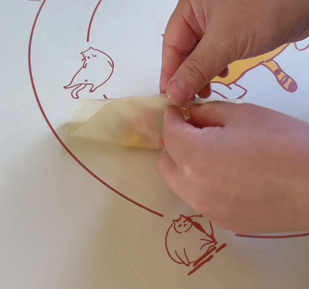 Gather the edges toward the center to form a pouch