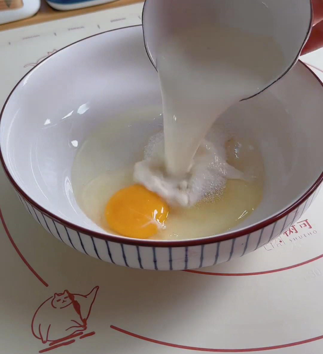 In a large bowl, crack in the egg and add the high-sugar-tolerant yeast, granulated sugar, and cold milk In a large bowl, crack in the egg and add the high sugar tolerant yeast, granulated sugar, and cold milk