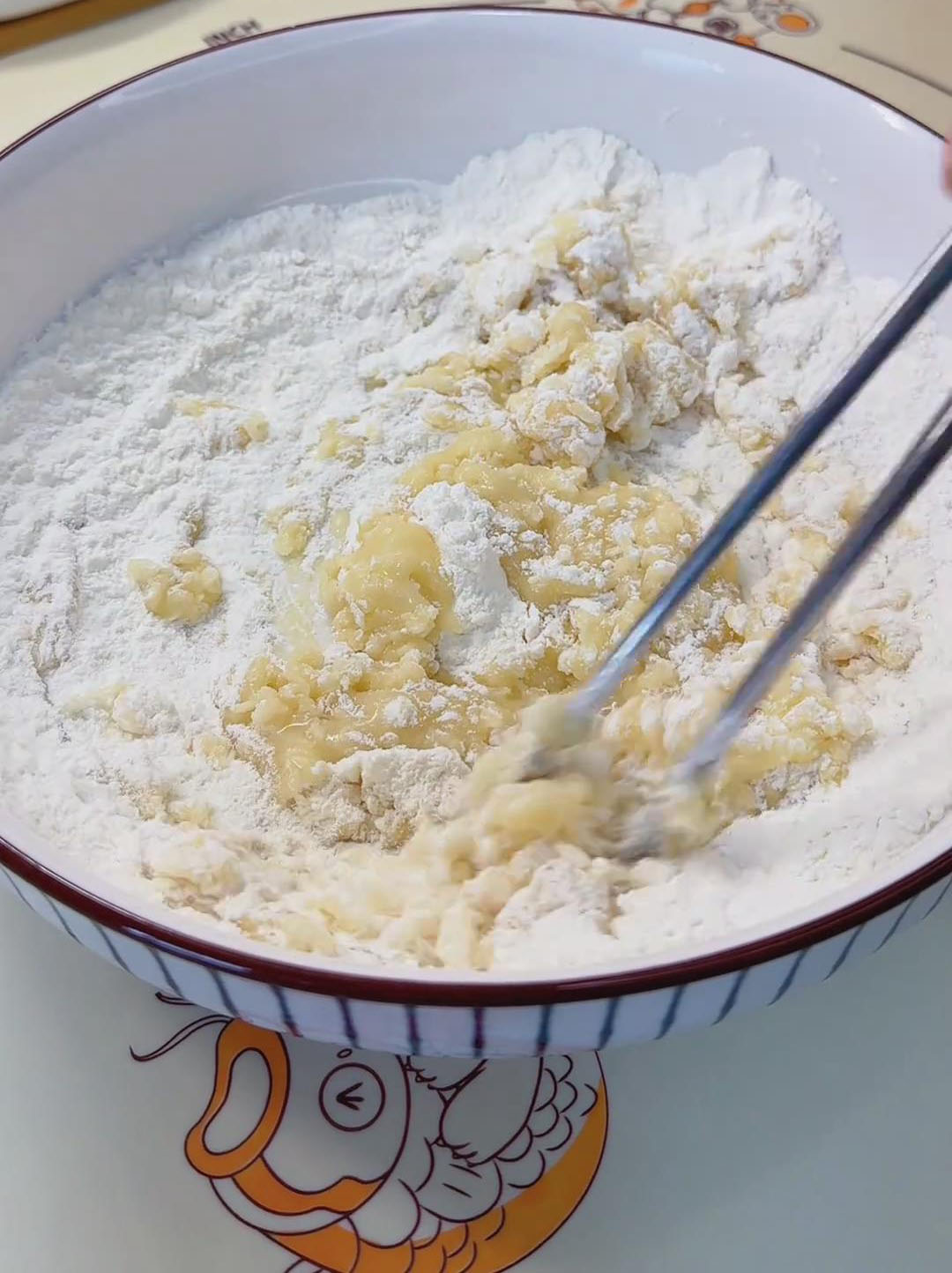 In a separate bowl, combine the flour and corn oil In a separate bowl, combine the flour and corn oil