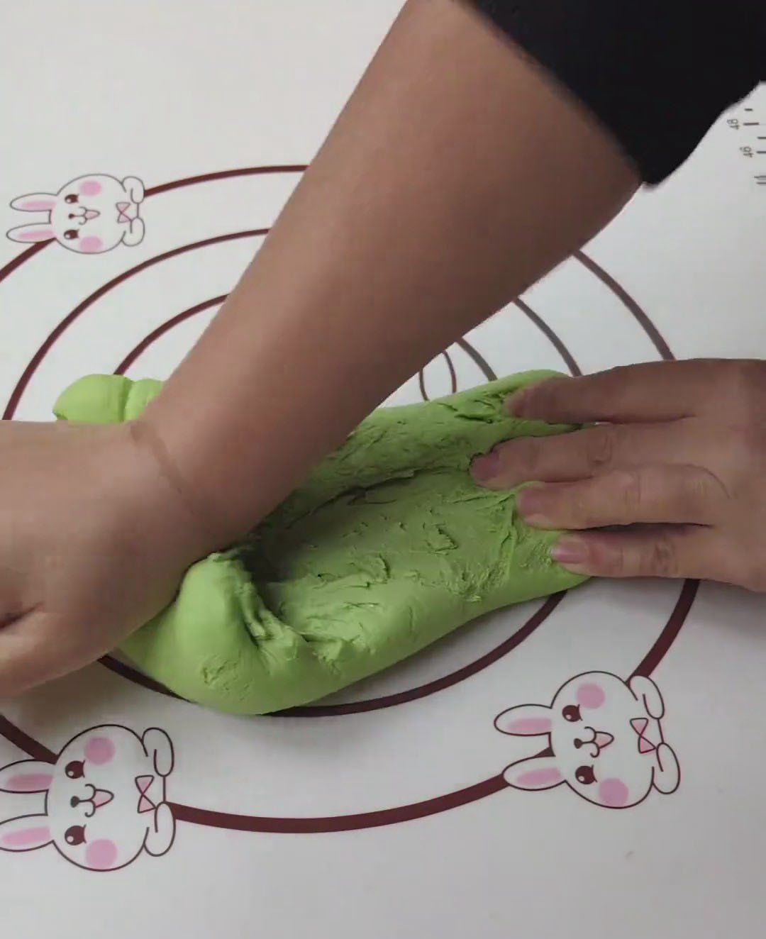 Knead vigorously by pressing, folding, and rubbing the dough against the surface Knead vigorously by pressing, folding, and rubbing the dough against the surface