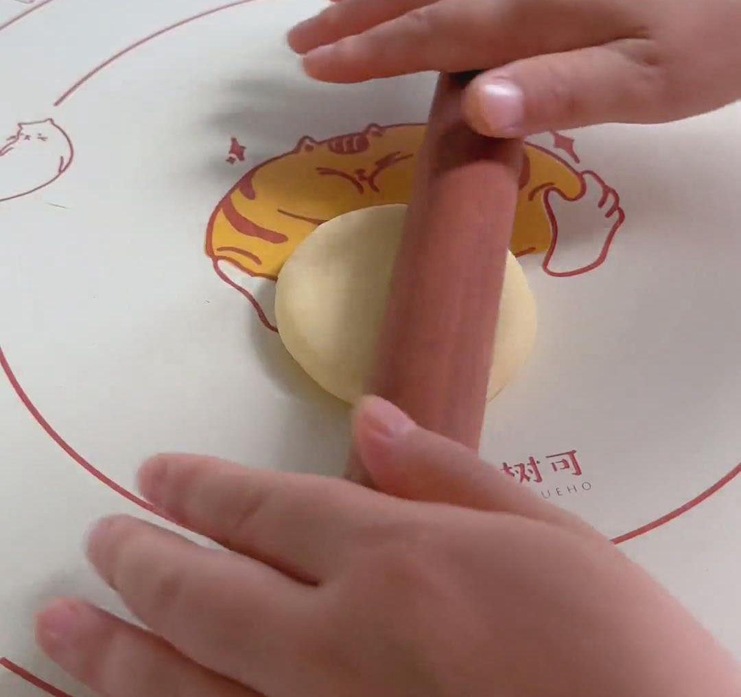 Lightly roll each filled bun with a rolling pin Lightly roll each filled bun with a rolling pin