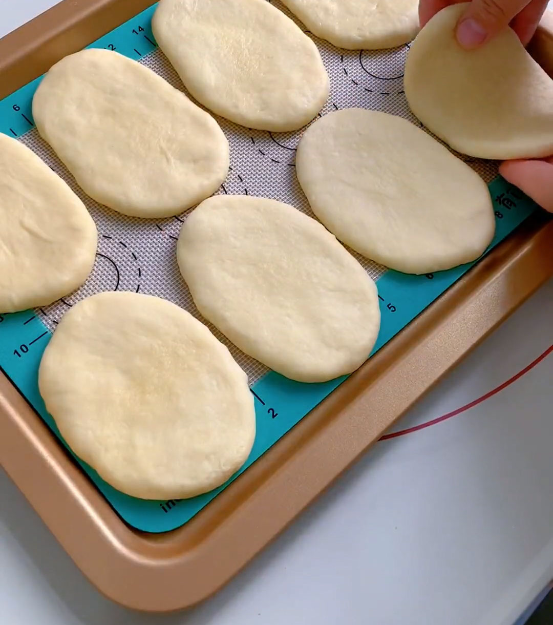 Place the shaped ovals on your prepared baking sheet
