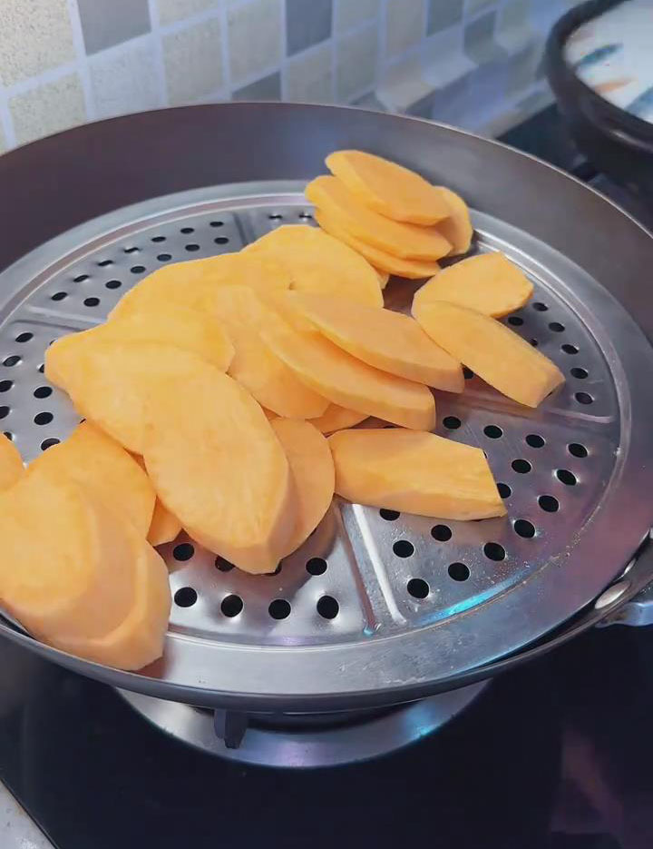 Place the sweet potato slices into a steamer