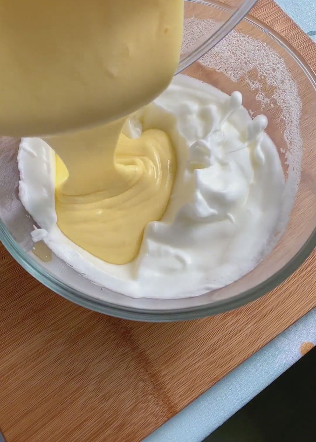Pour this lightened mixture back into the bowl with the remaining meringue