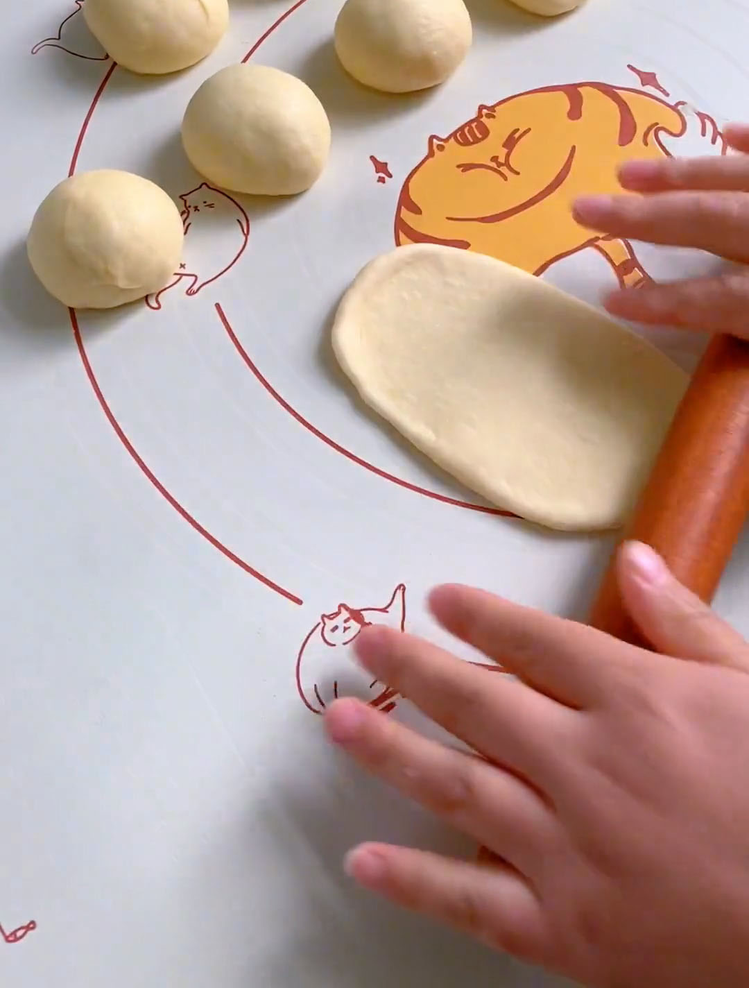 Use a rolling pin to roll each ball into an oval shape