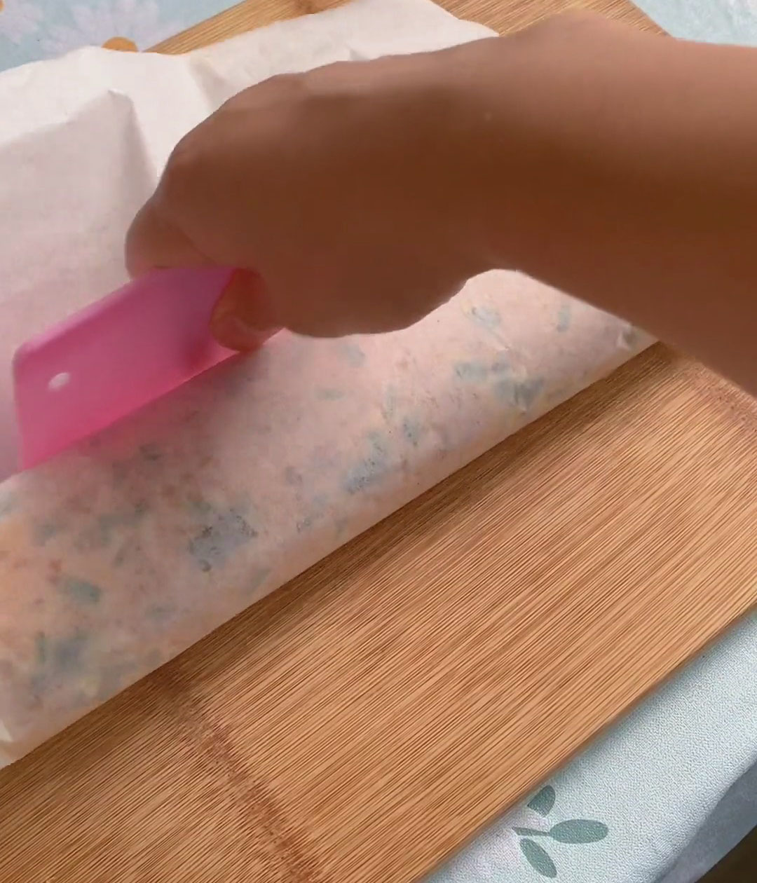 Use an offset spatula to gently press and compact it as you go